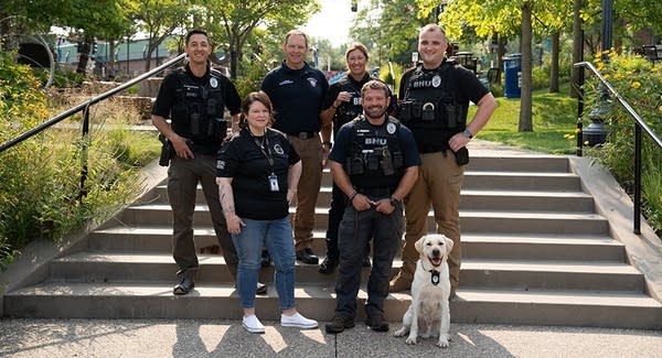 A group of officers pose on stairs