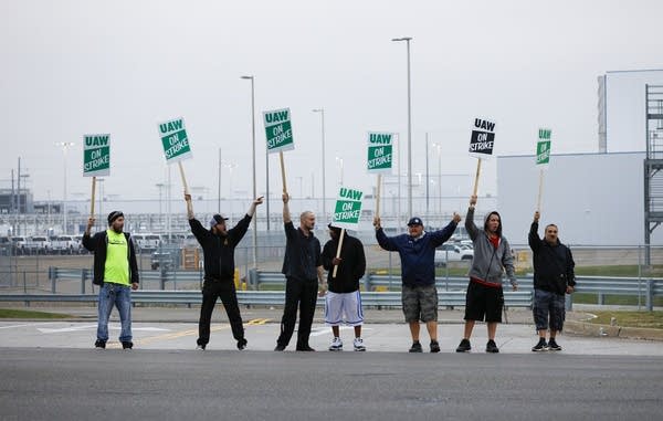 United Auto Workers members picket at the General Motors assembly plant in Flint, Michigan, in September.