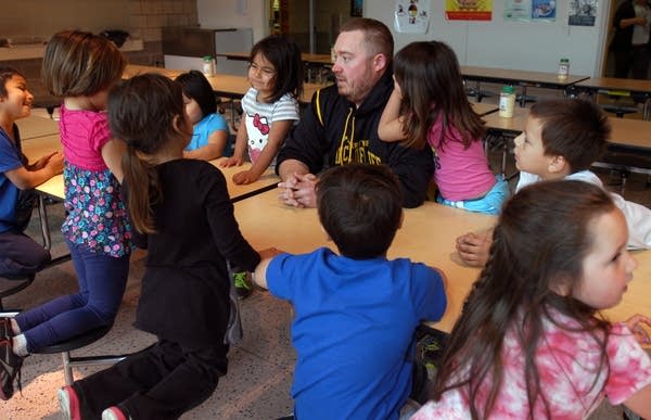 Seth Houglum gathers his kindergarteners to get ready for lunch.