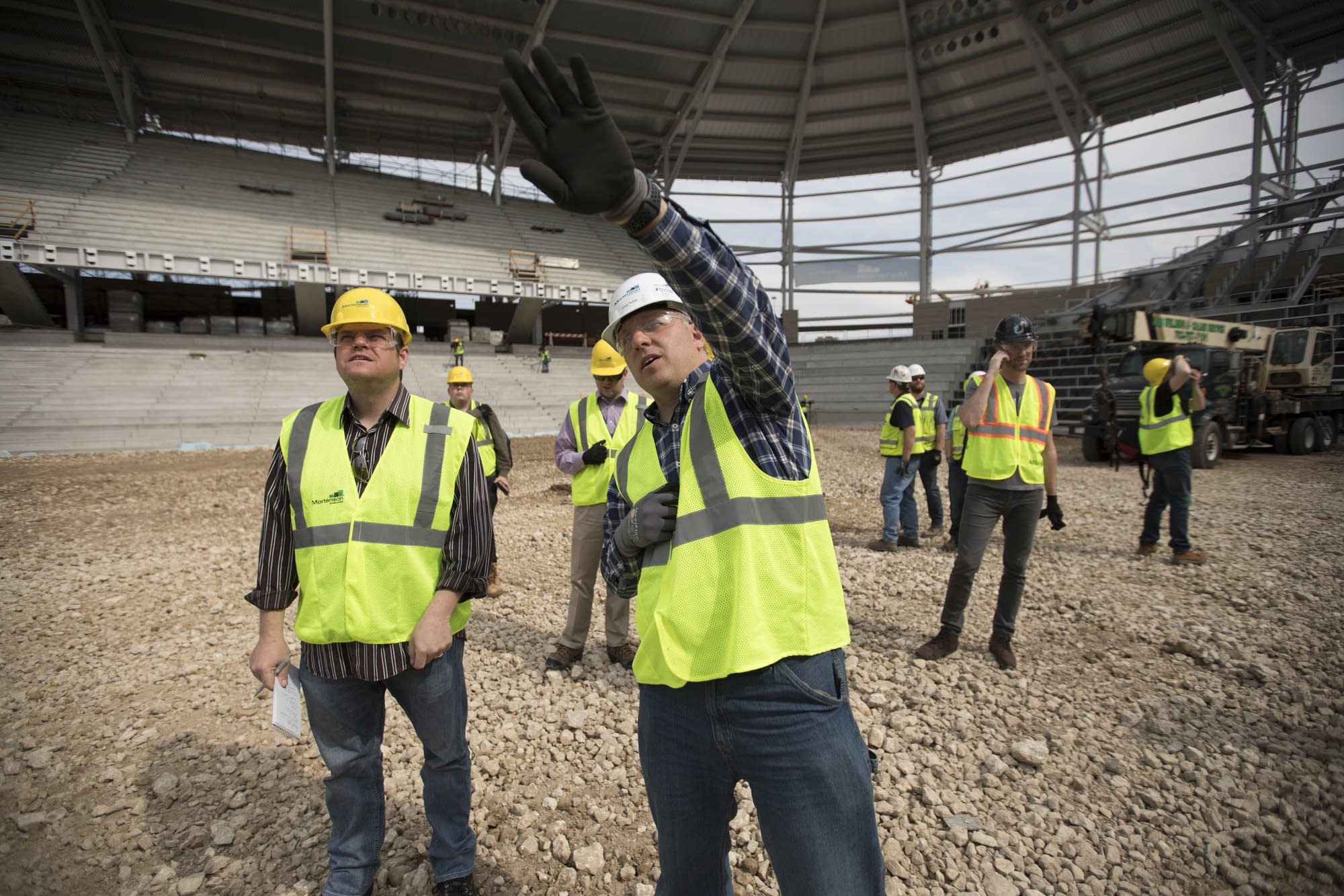 Greg Huber of Mortenson Construction talks to media.