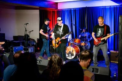 Band performing on stage and crowd watching