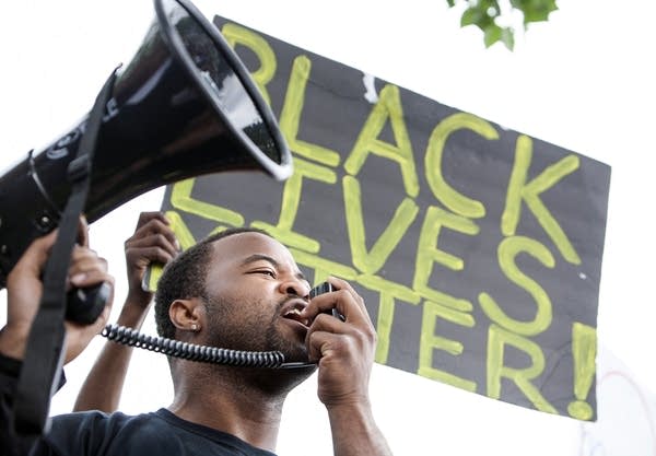 Organizer Rashad Turner lead a chant.