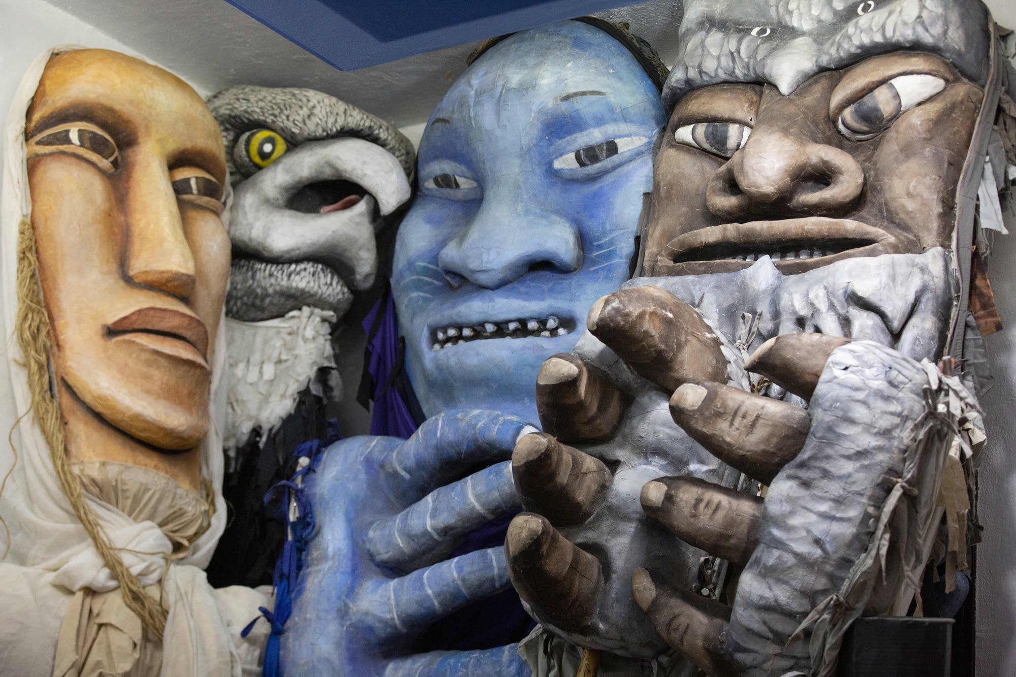 Large-scale puppets represent the sky, woods, prairie and river.