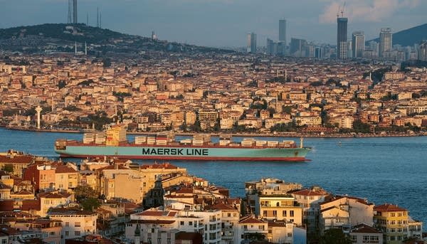 photo showing houses and buildings of Istanbul with Bosporus waterway off…