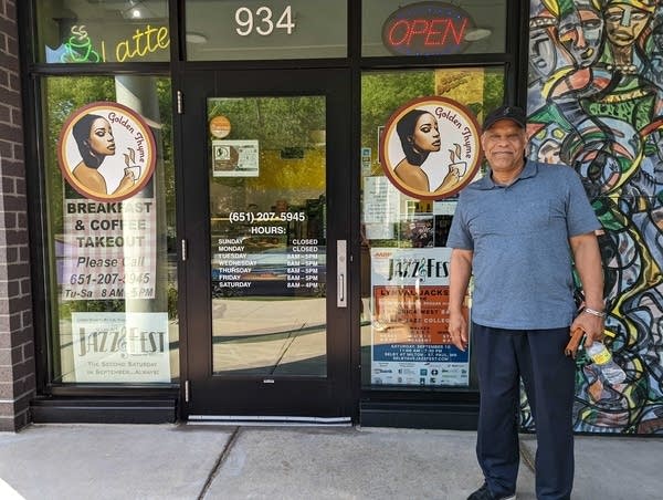 Festival organizer in front of store