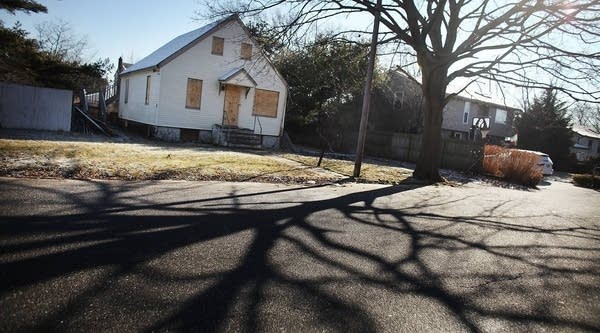 A foreclosed home stands boarded up on February 9, 2012 in Islip, New York.