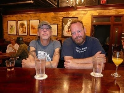 Two men sit at a bar in Minneapolis