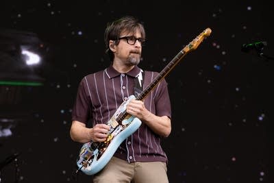 the band weezer performing on stage
