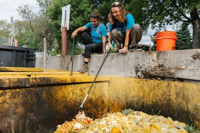 People pick garbage out of compost