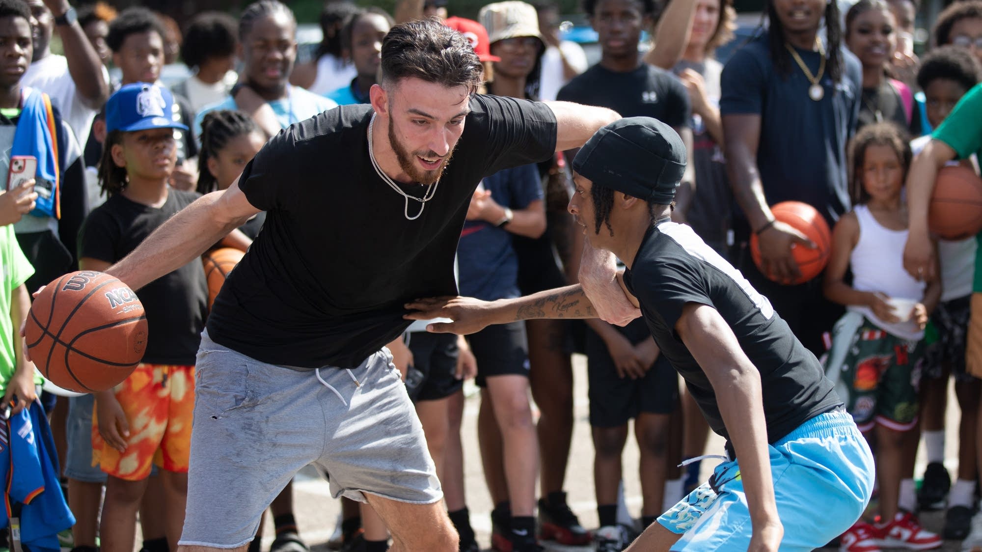 Minnesotan Chet Holmgren returns with an NBA championship trophy — and hoops with kids
