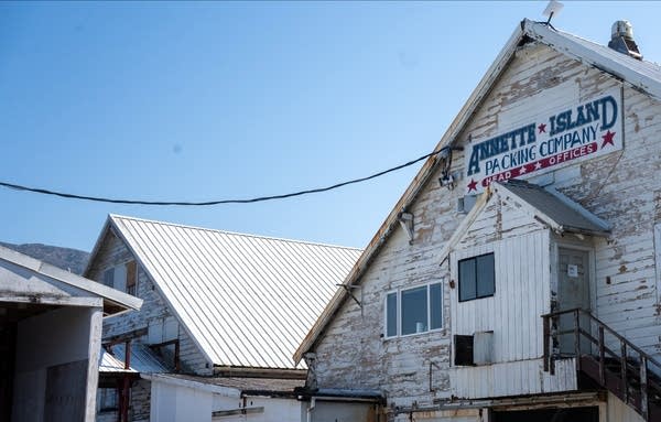 A gray building with peeling paint.