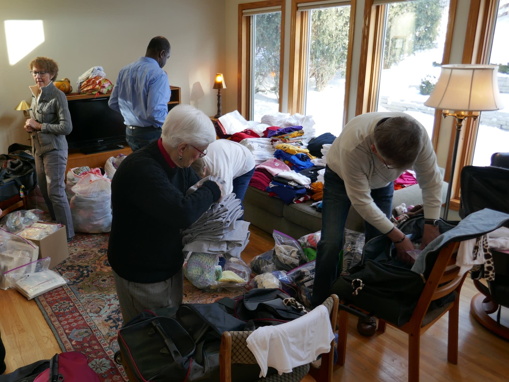 Volunteers with Arm in Arm in Africa pack donations and supplies