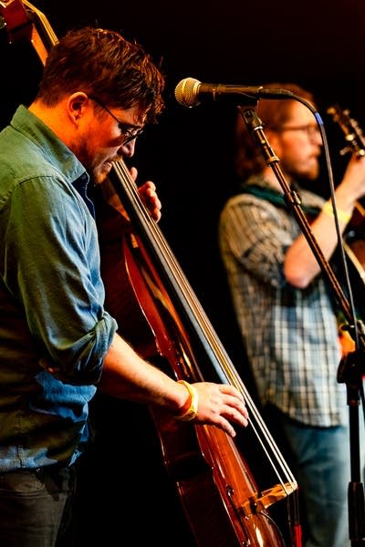 Two musicians performing together onstage