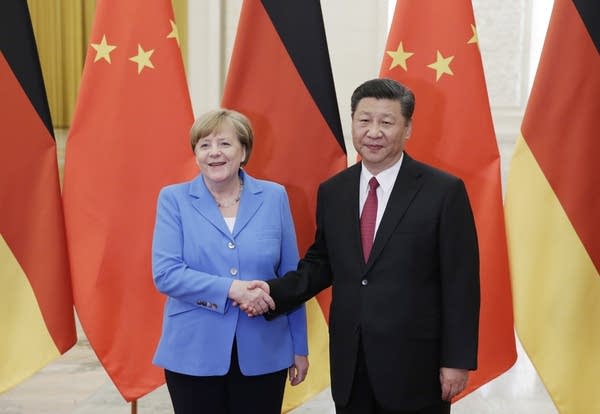 China's President Xi Jinping (R) meets German Chancellor Angela Merkel at the Great Hall of the People in Beijing, China, May 24, 2018.