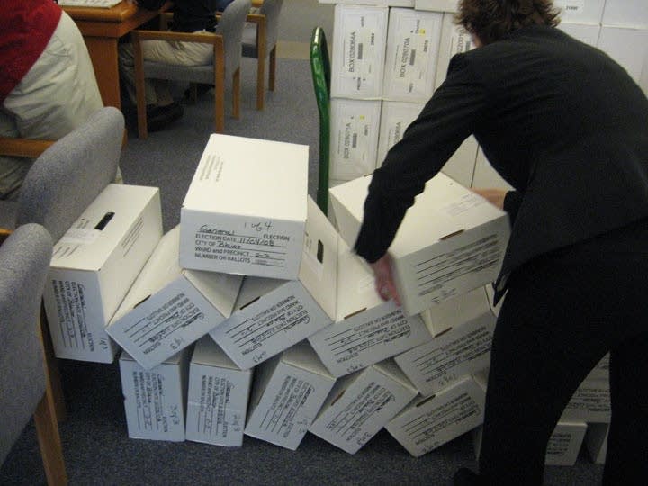 Boxes of ballots knocked over