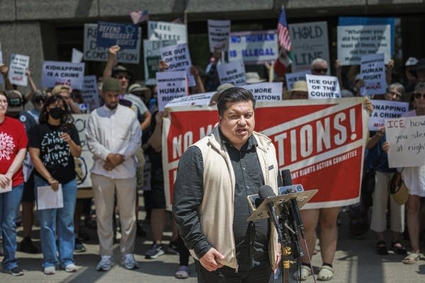 Immigrant rights advocates hold a press conference outside the Whipple Federal Building