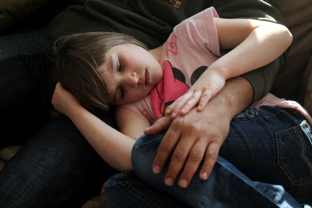 In her fathers arms