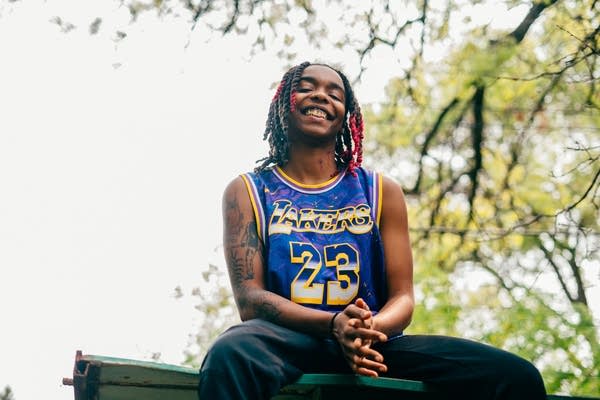 Woman in Blue Jersey with red dreadlocks 12