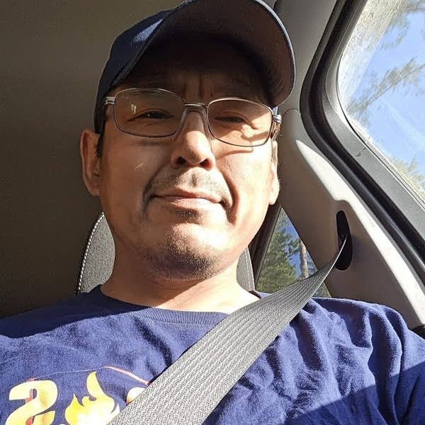 A man smiles for a selfie