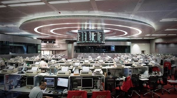 A trader is seen on the floor of the Hong Kong Stock Exchange on August 12, 2015. 