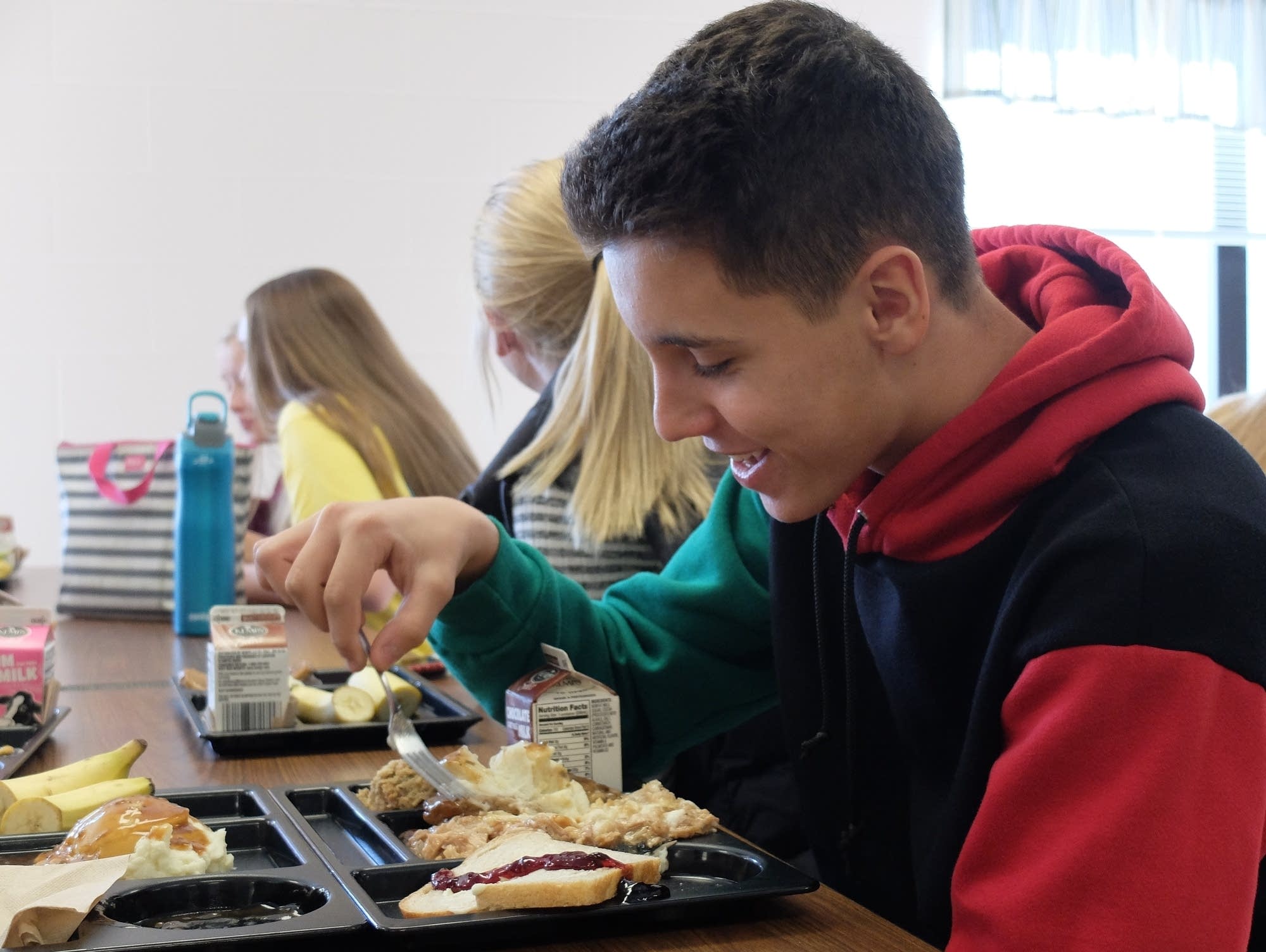 Brad Krebsbach eats lunch in the school cafeteria.