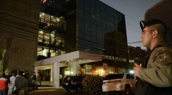 Police stand guard outside the Mossack Fonseca law firm offices in Panama City during a raid on Tuesday.