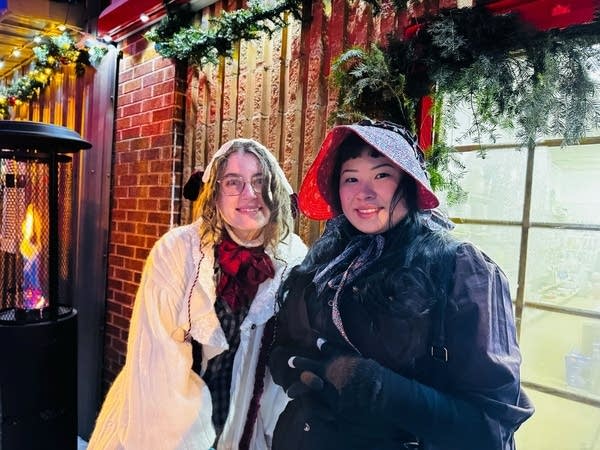 two people posing for pic at festival