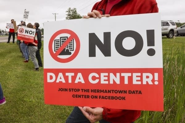 A sign reads "No! Data Center"