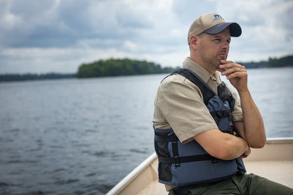 A DNR officer sits on a boat