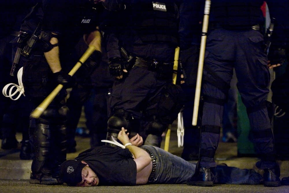 Police arrest a protester