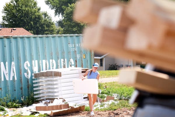 A person carries construction materials 