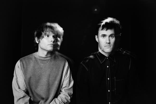 Two men pose for a photo.