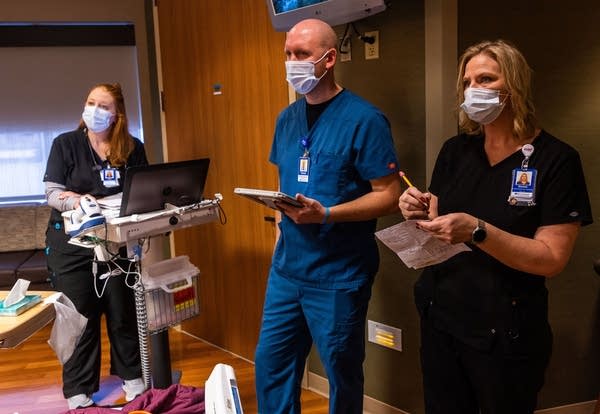 three health care providers at a hospital