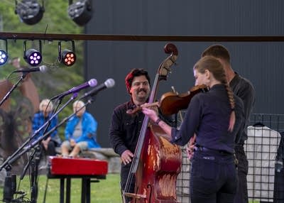 the band wild horses performing on an outdoor stage