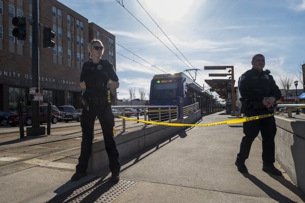 Metro Transit Police officers stand guard.