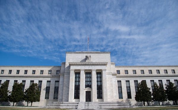 As the Fed has scooped up assets to carry out quantitative easing, some are asking: At what cost? Above, the Federal Reserve building in Washington, D.C.
