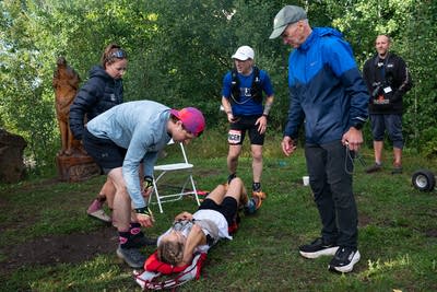 Jessie Diggins rests on the ground