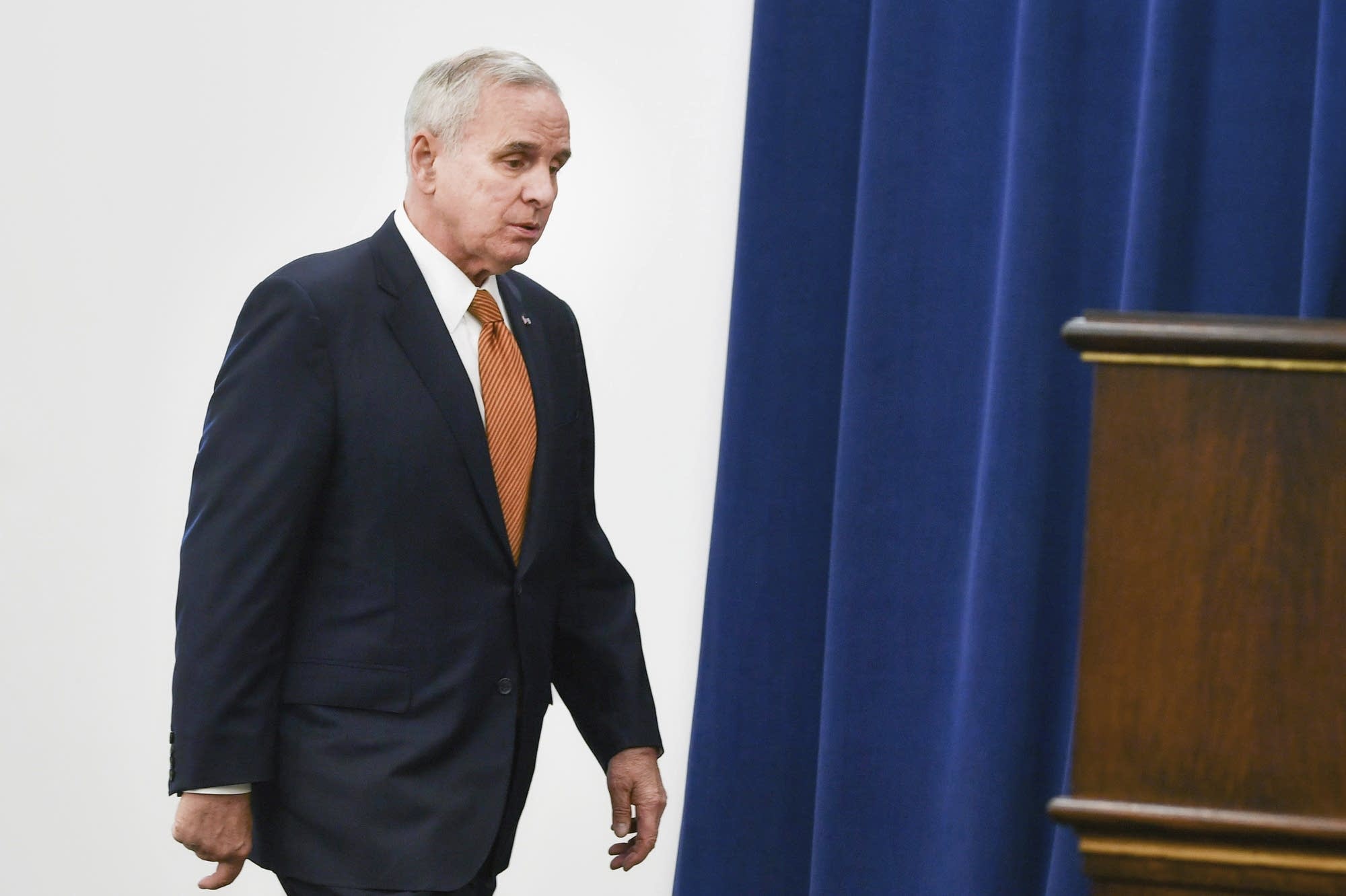 Governor Mark Dayton enters a press conference.