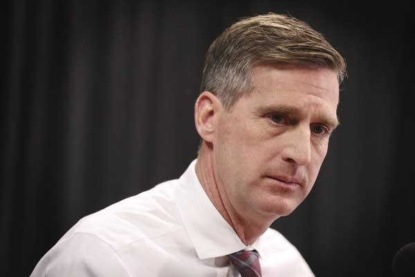 Minnesota athletic director Mark Coyle speaks during a news conference.