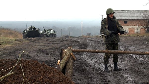 A Ukrainian soldier guards a road near the Russian border in April 2014, just weeks after Russia invaded and annexed Crimea. After the invasion, Ukraine rejected Russia’s industrial standards and opted for Europe’s instead.