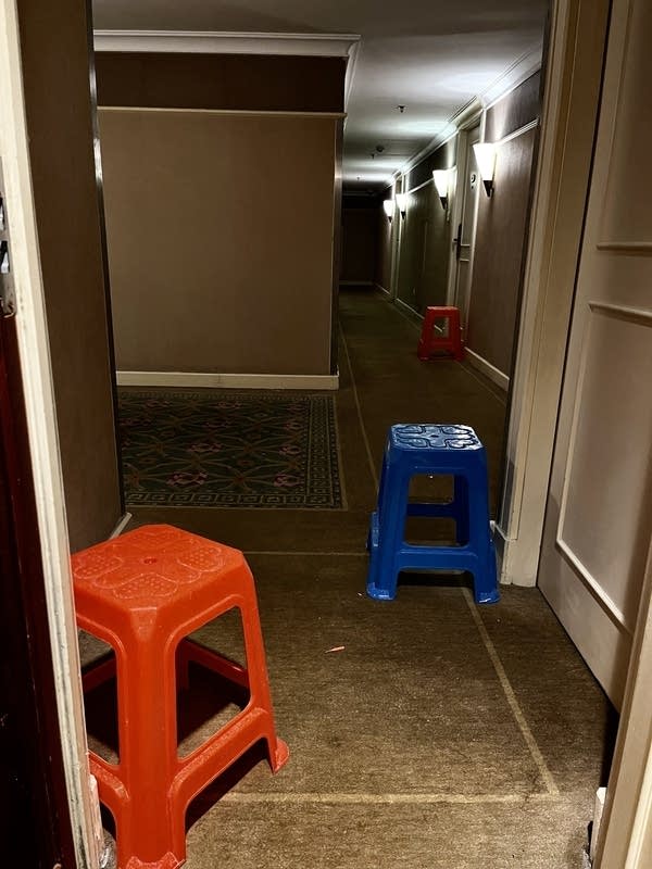 Plastic stools are placed outside quarantine rooms for contactless meal deliveries. Guests are only allowed to retrieve the meals once they hear an automated message play. (Courtesy Pak)