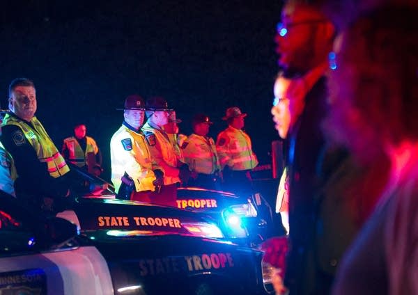 State Patrol troopers and protesters