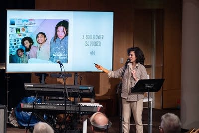 host diane speaking to audience