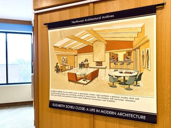 an exhibit poster hangs on a wall