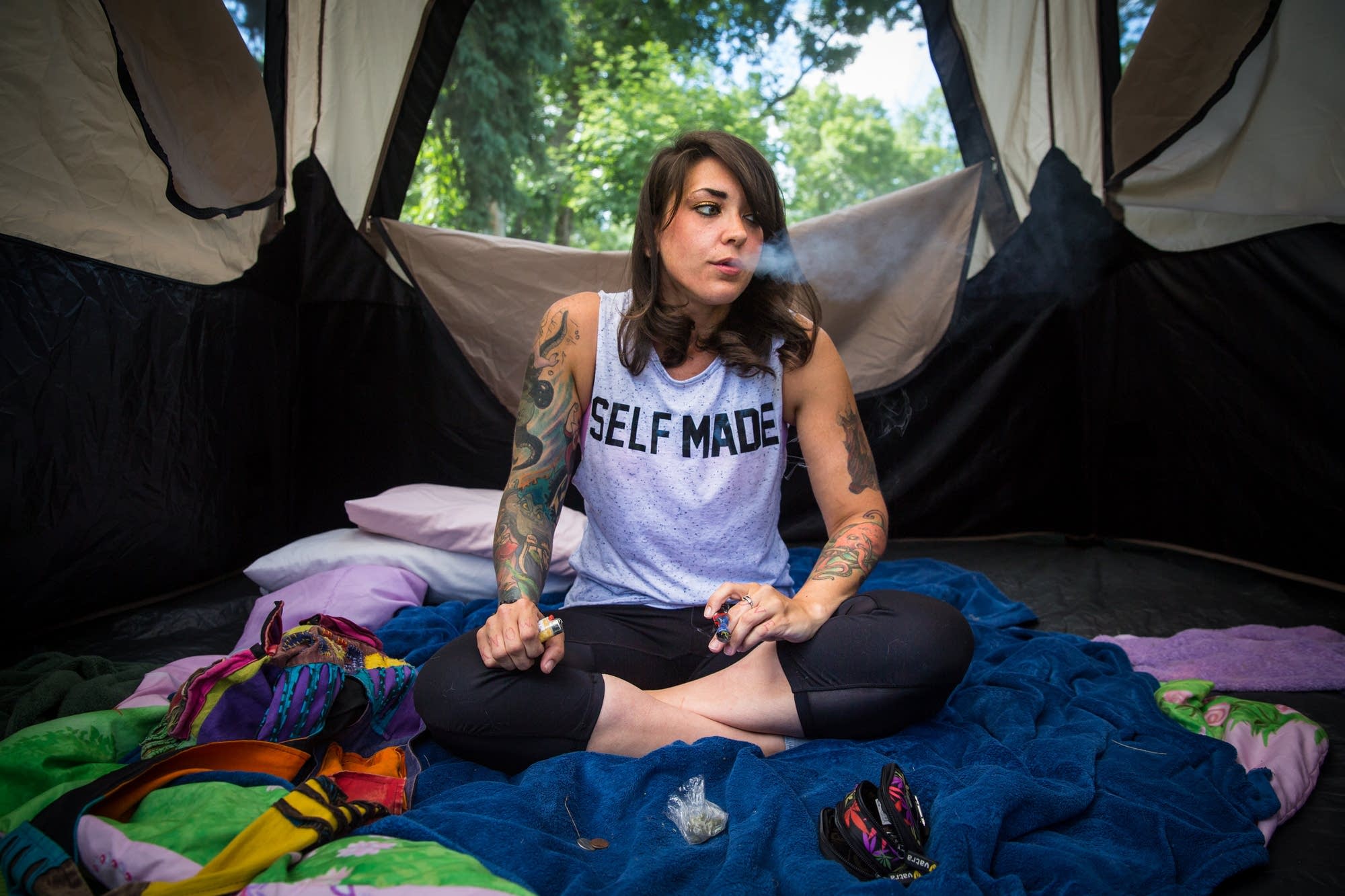 Jennessa Lea smokes marijuana in her backyard.