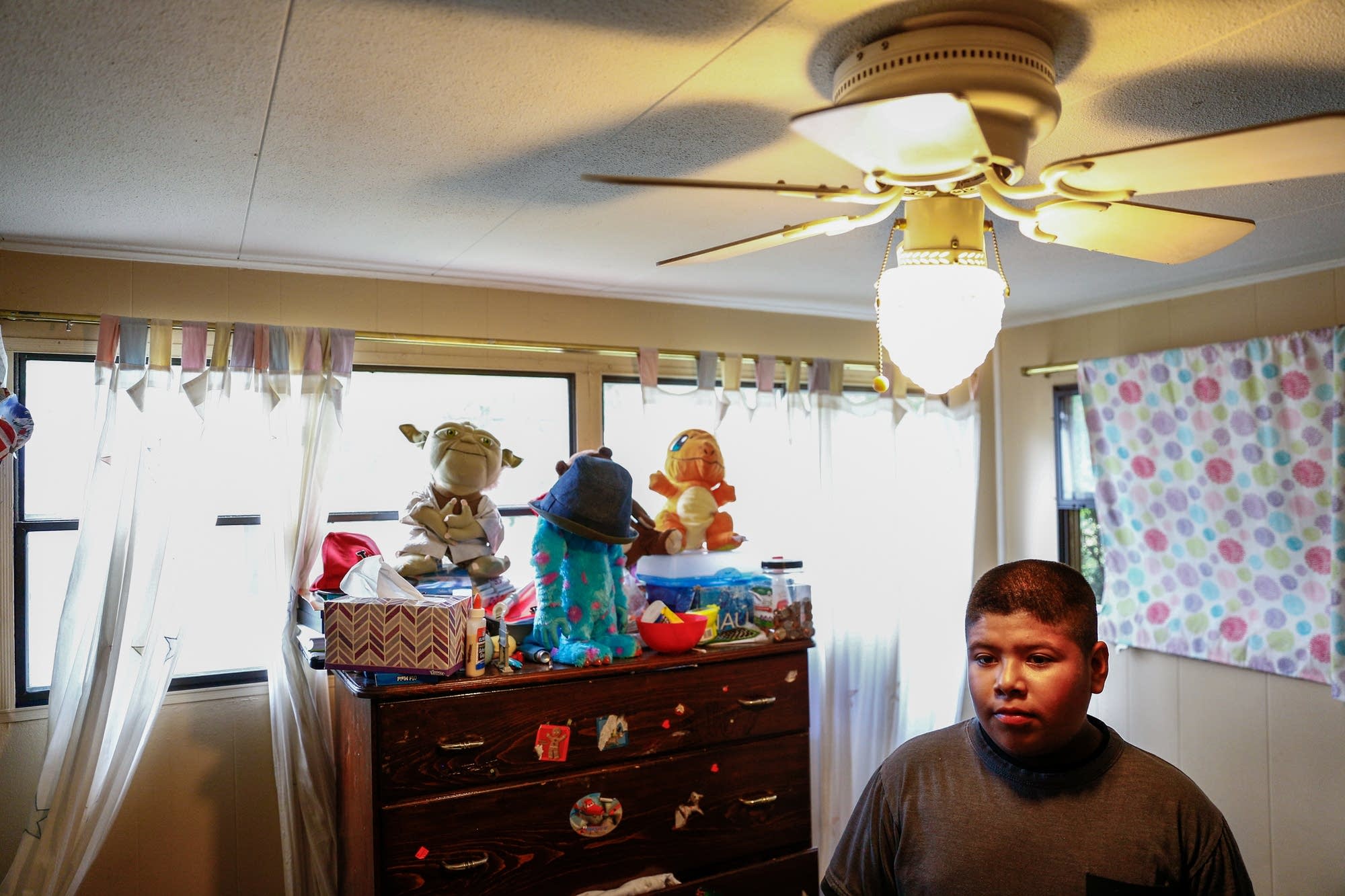 Elvy Rosendo stands in his room.
