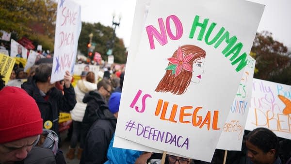 Immigration rights activists take part in a rally in front of the US Supreme Court in Washington, DC on November 12, 2019.