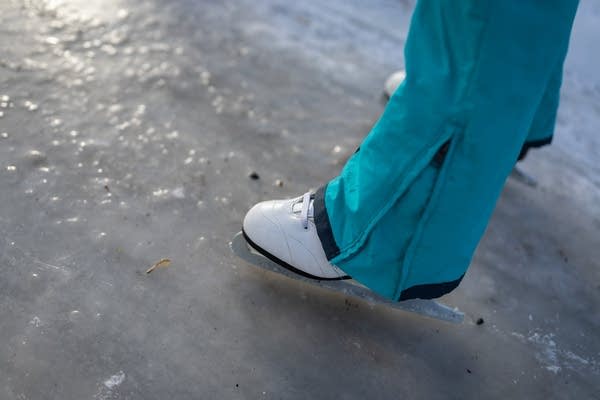 A person skates on a trail