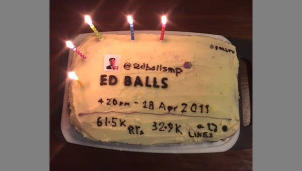 A cake decorated to look like a tweet that says "ED BALLS"