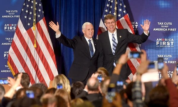 VP Mike Pence, left, greets supporters with Rep. Erik Paulsen.